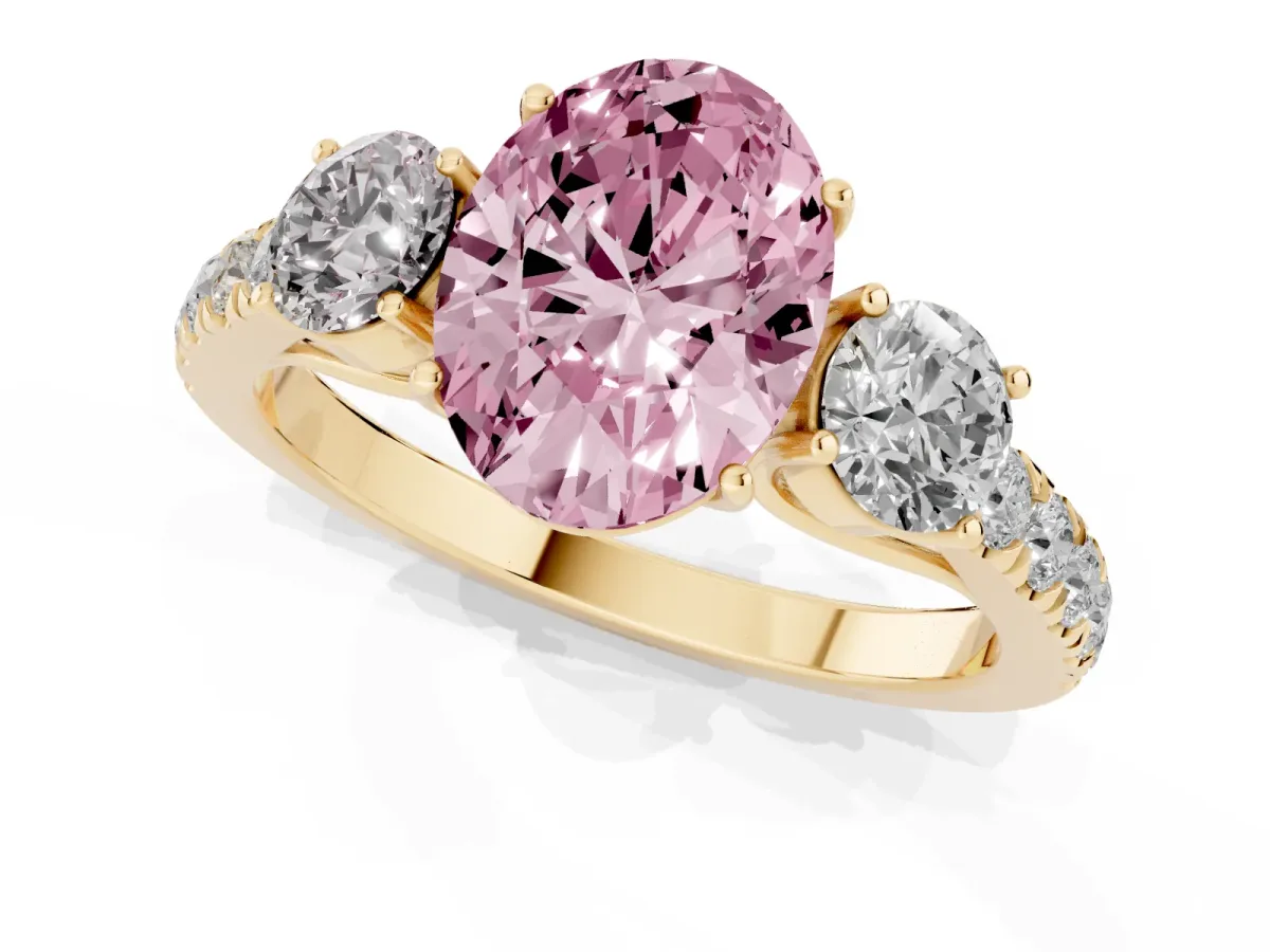 Fancy Pink Oval Cut Cut Diamond Three-Stone Ring with Round Side Stones and Pavé Band Yellow gold