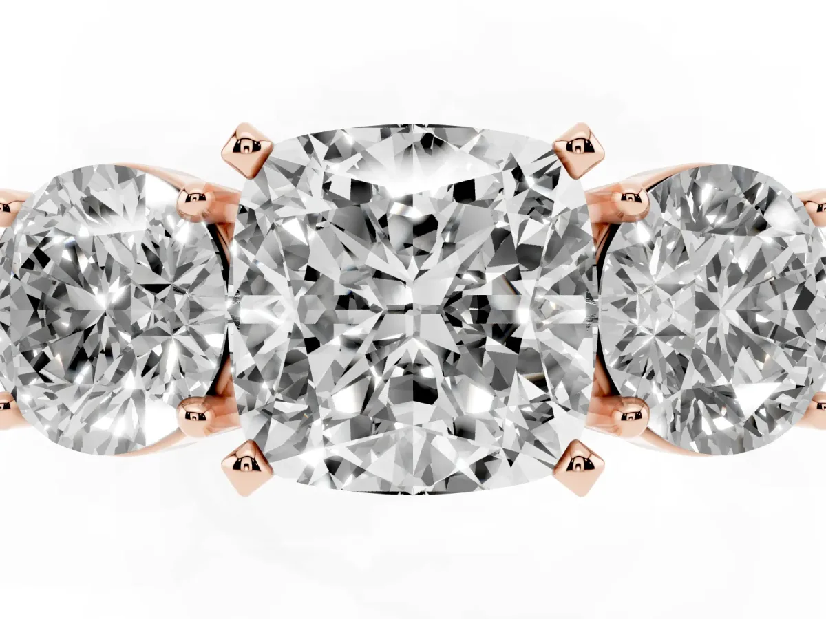 Three-Stone Cushion Cut Diamond Ring with Round Side Stones, Classic Band, and Four-Prong Setting Rose gold