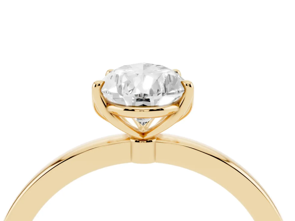 Pear Cut Diamond Solitaire Ring with Thin Band and Prong Setting Yellow gold