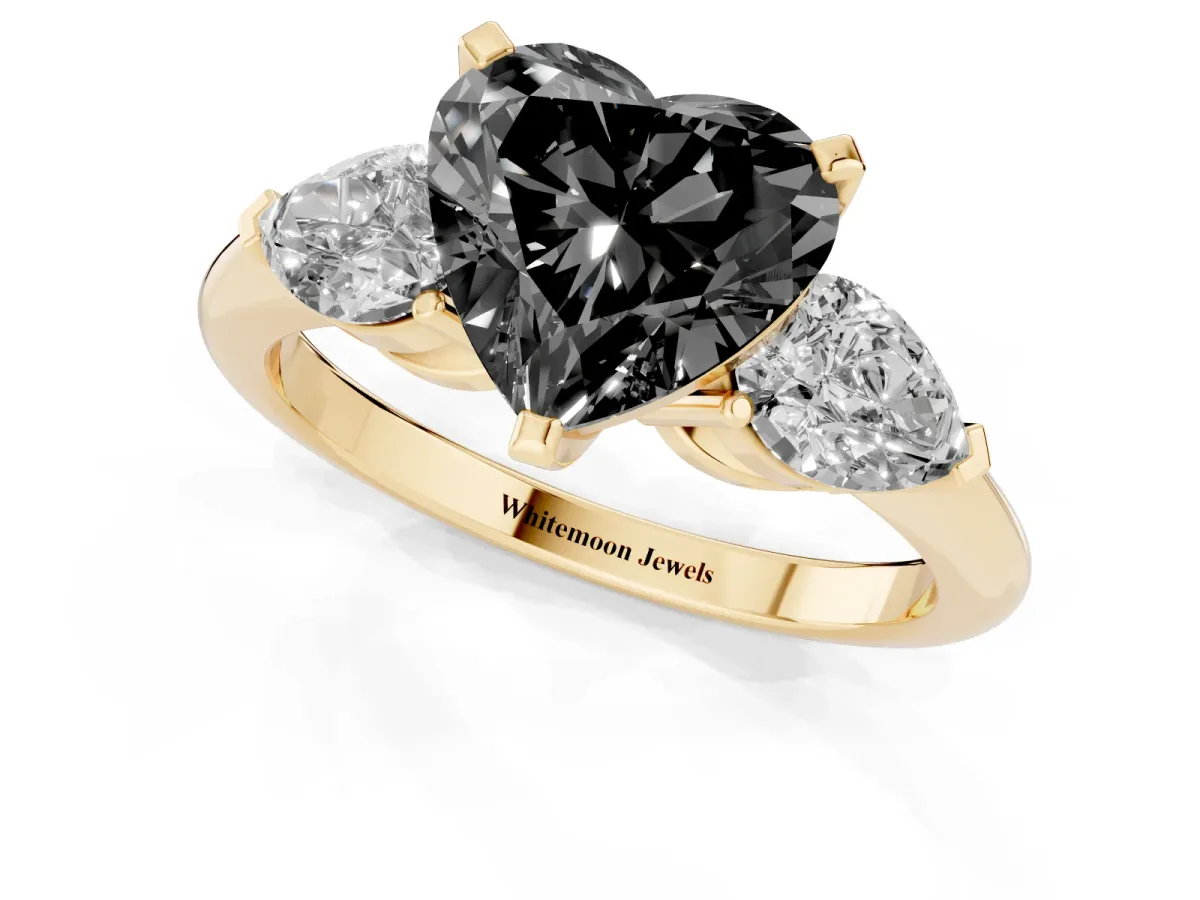 Fancy Black Three-Stone Heart Cut Diamond Ring with Pear Side Stones and Four-Prong Setting Yellow gold