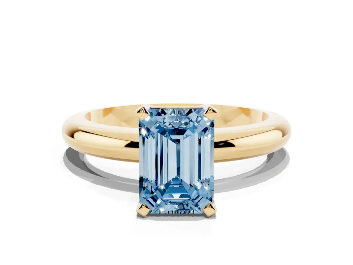 Fancy Blue Emerald Cut Diamond Solitaire Engagement Ring with Round Band and Four-Prong Setting Yellow gold