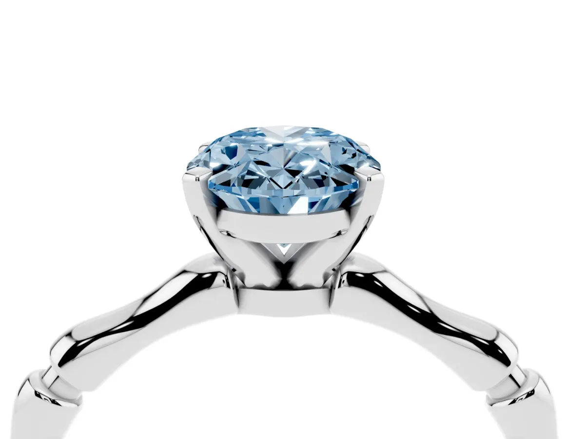 Fancy Blue Oval Cut Solitaire Diamond Ring with Bamboo Band and Four-Prong Setting Silver