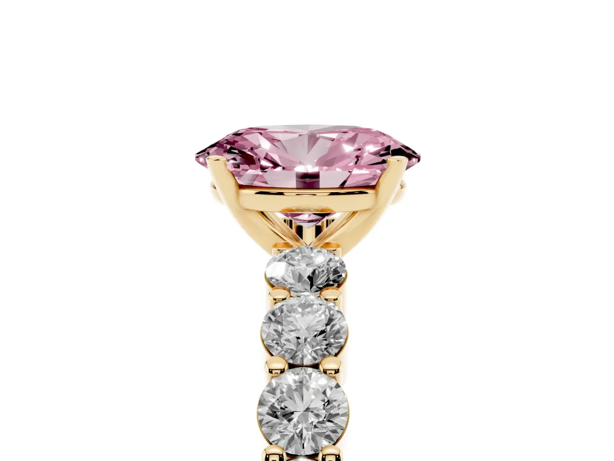 Fancy Pink Oval Cut Diamond Solitaire Ring with Shared Prong Round Side Stones Yellow gold