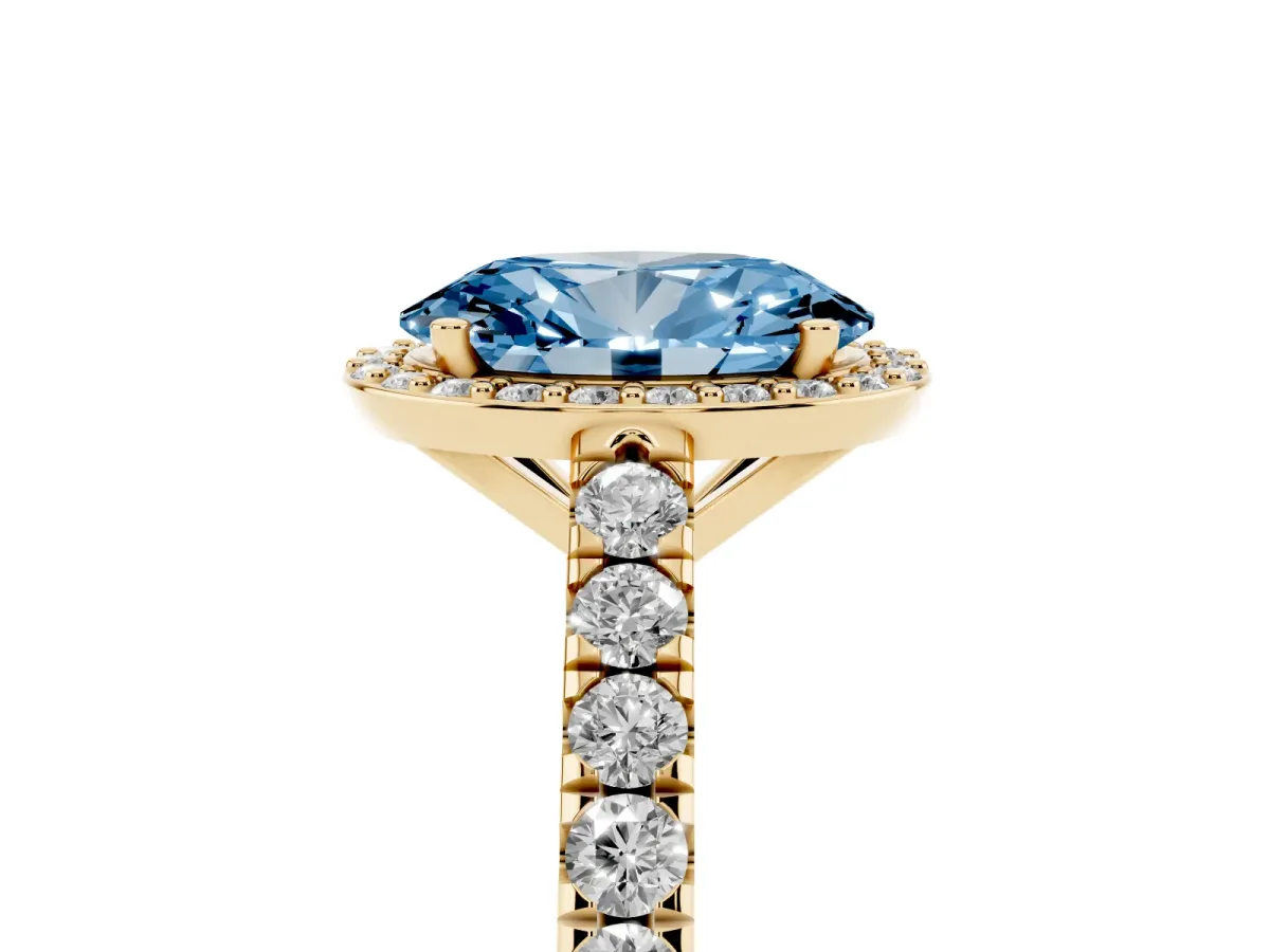 Fancy Blue Oval Cut Cut Halo Diamond Engagement Ring with Pave Band and Four-Prong Setting Yellow gold
