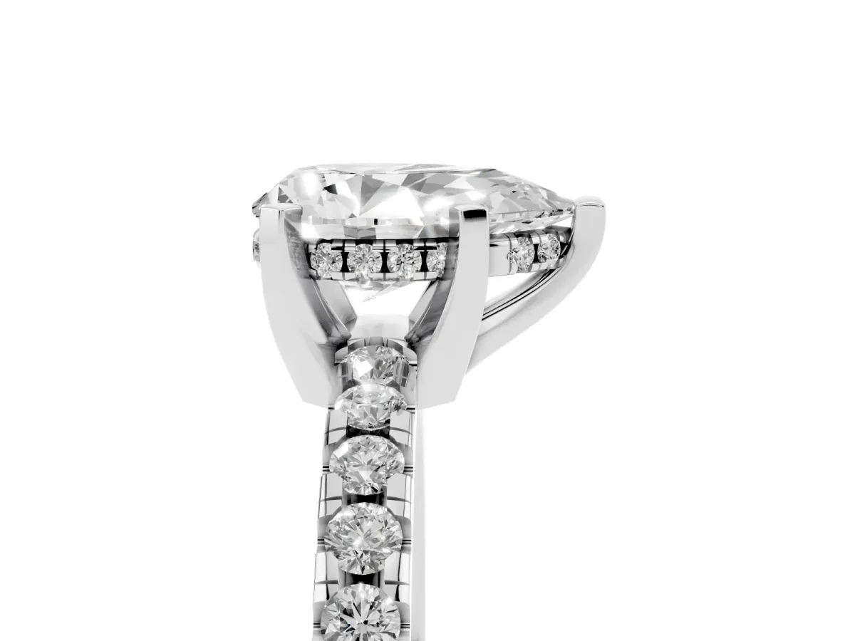 Pear Cut Diamond Solitaire Ring with Round Pavé Band and Four-Prong Setting Silver