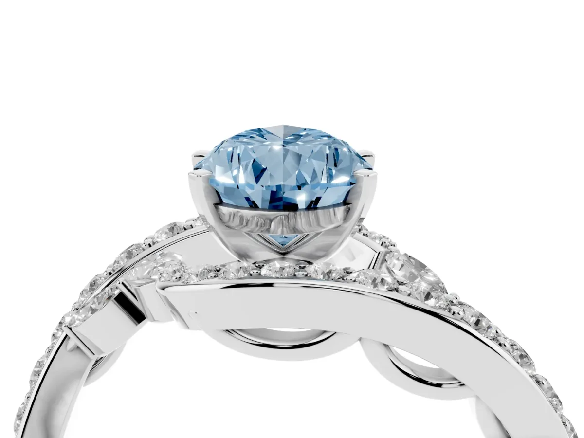 Fancy Blue Pear Cut Solitaire with Pavé Twist Band and Four-Prong Setting Silver