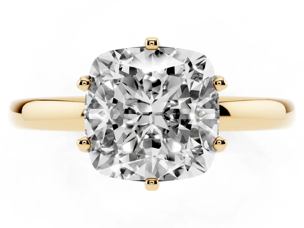 Cushion Cut Solitaire Diamond Ring with Six-Prong Setting on a Classic Band Yellow gold