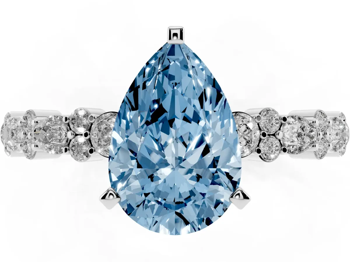 Fancy Blue Pear Cut Diamond Side Stone Solitaire Ring with Round and Four-Prong Setting White gold