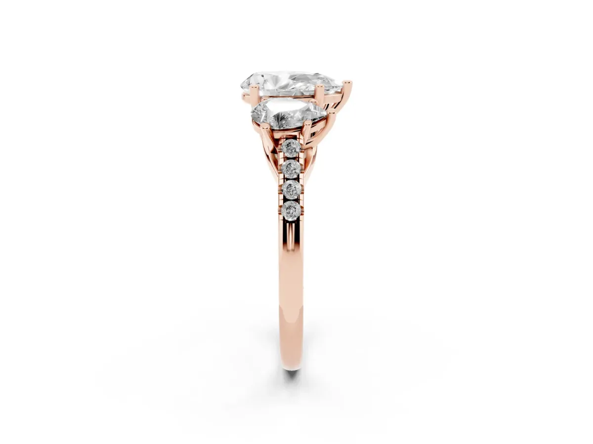 Three-Stone Pear Cut Diamond Ring with Round Pavé Band and Prong Setting Rose gold