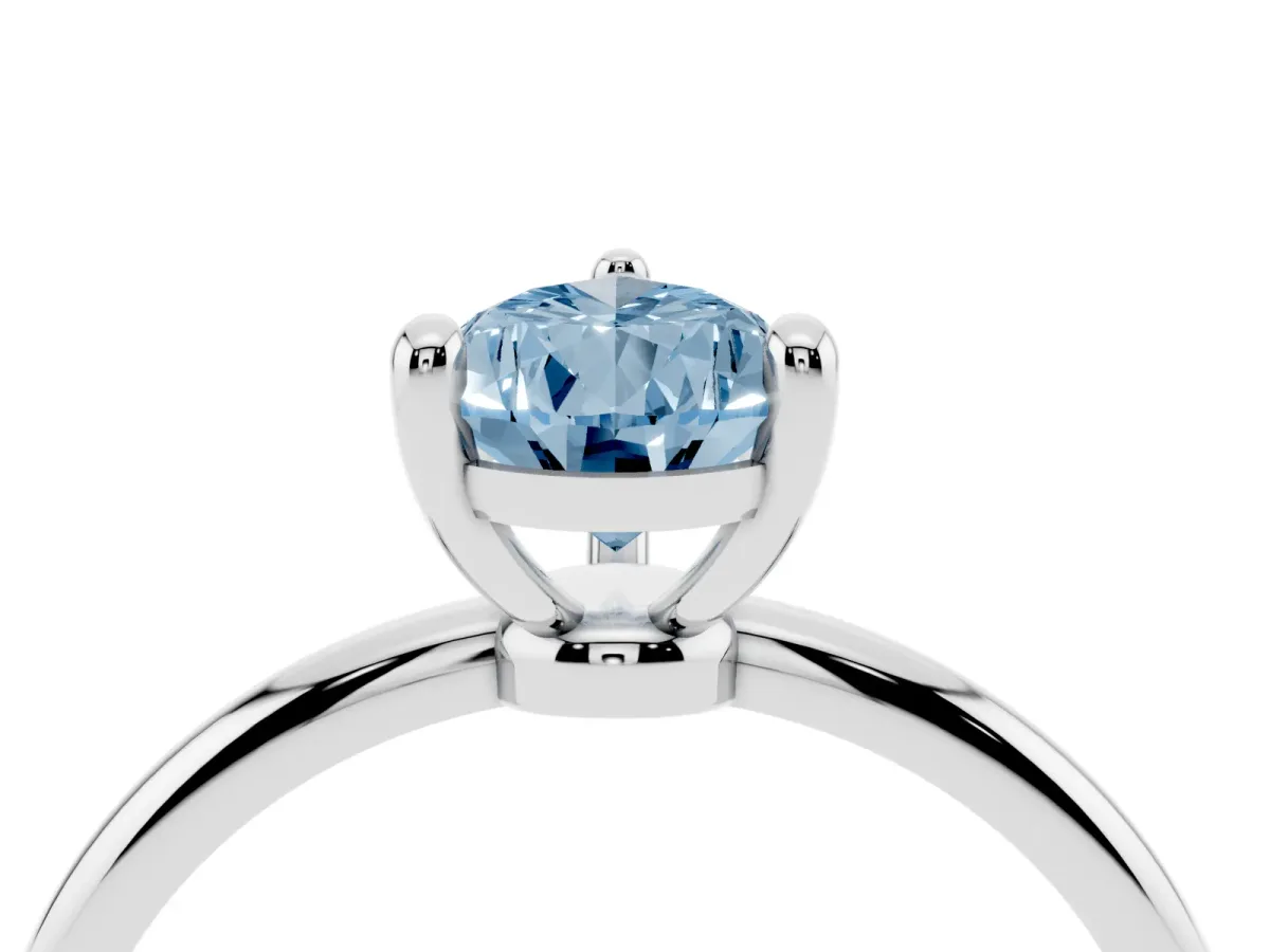 Fancy Blue Pear Cut Solitaire Diamond Ring with 4-Prong Setting on a Classic Band Silver