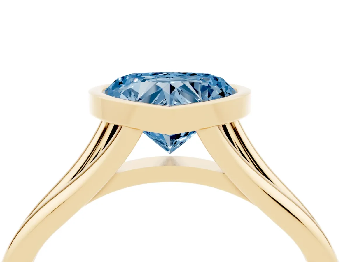 Fancy Blue Bezel Set Heart Cut Cut Solitaire Ring with Tapered Band Yellow gold