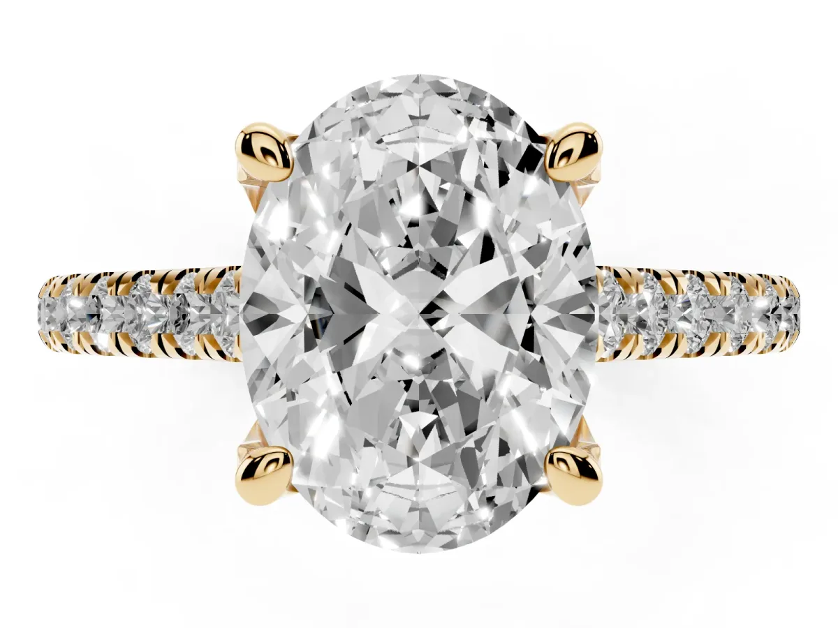 Oval Cut Brilliant Diamond Solitaire with Pavé Band and Four-Prong Setting Yellow gold