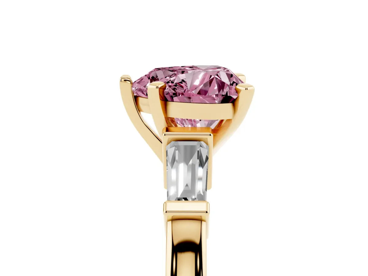 Fancy Pink Heart Cut Cut Diamond Solitaire Ring with Tapered Baguette Accents and Four-Prong Setting Yellow gold