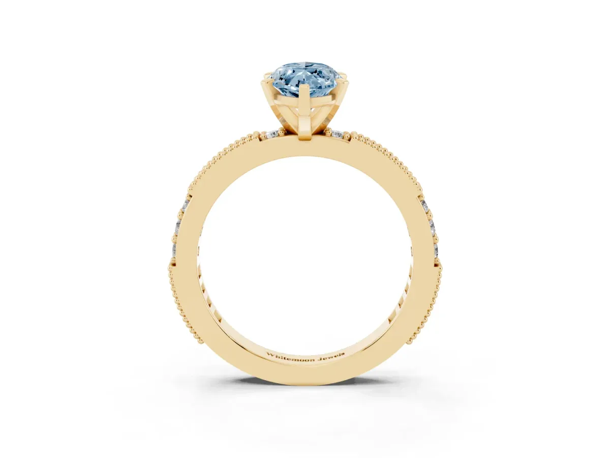 Fancy Blue Marquise Cut Solitaire with Pavé Band and Four-Prong Setting Yellow gold