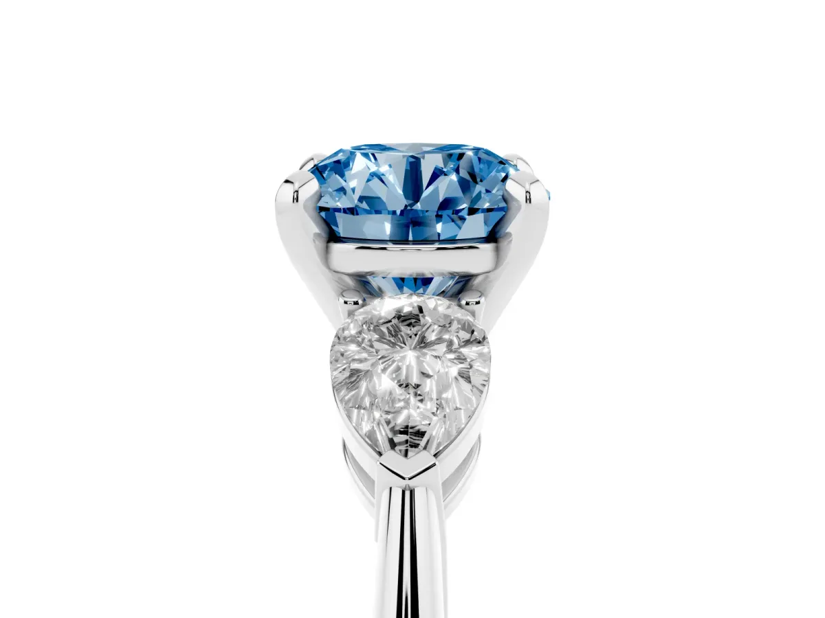 Fancy Blue Three-Stone Round Cut Diamond Ring with Pear Side Stones and Four-Prong Setting Platinum