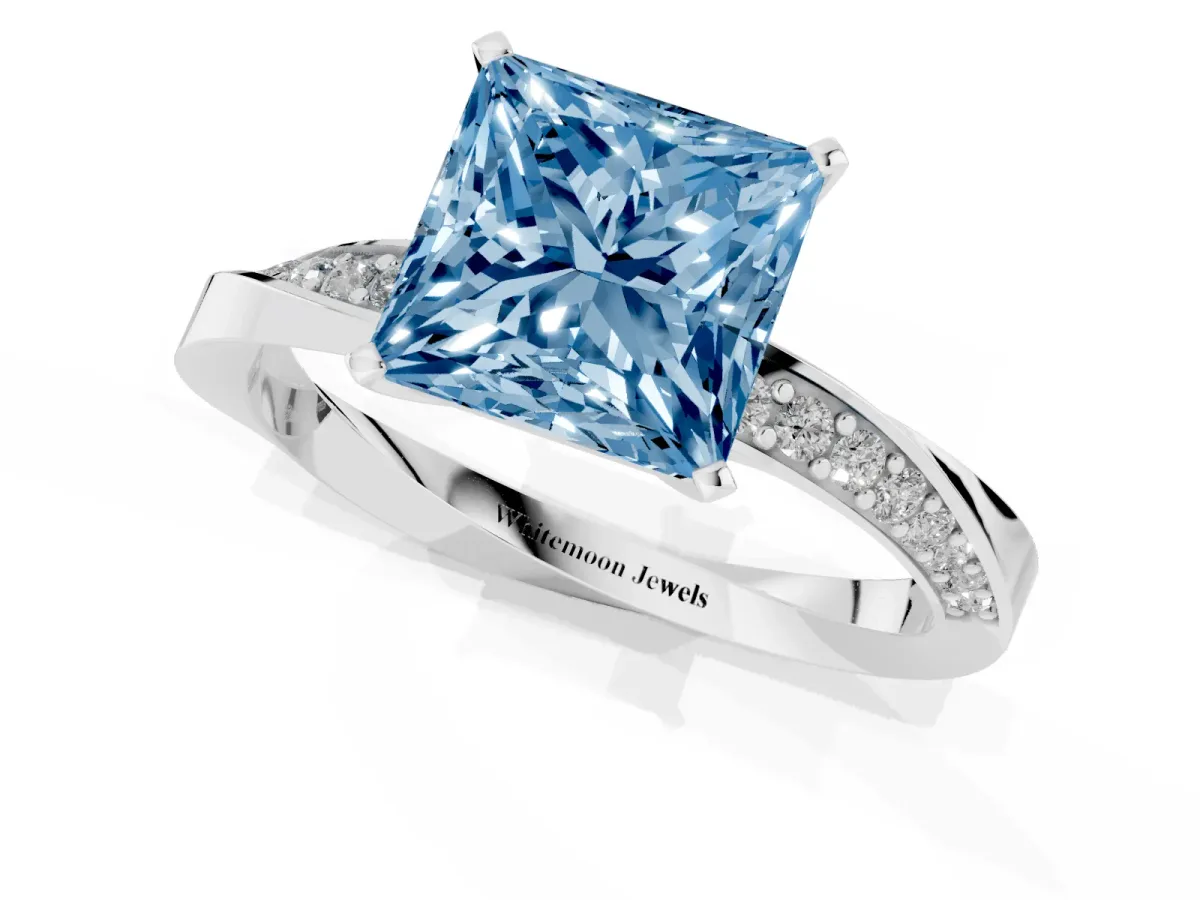 Fancy Blue Princess Cut Diamond Engagement Ring with Side Stone Accents and Four-Prong Setting Platinum