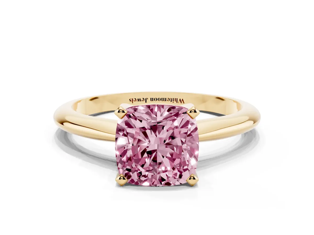 Fancy Pink Cushion Cut Cut Solitaire Ring with Four-Prong Setting on a Classic Band Yellow gold