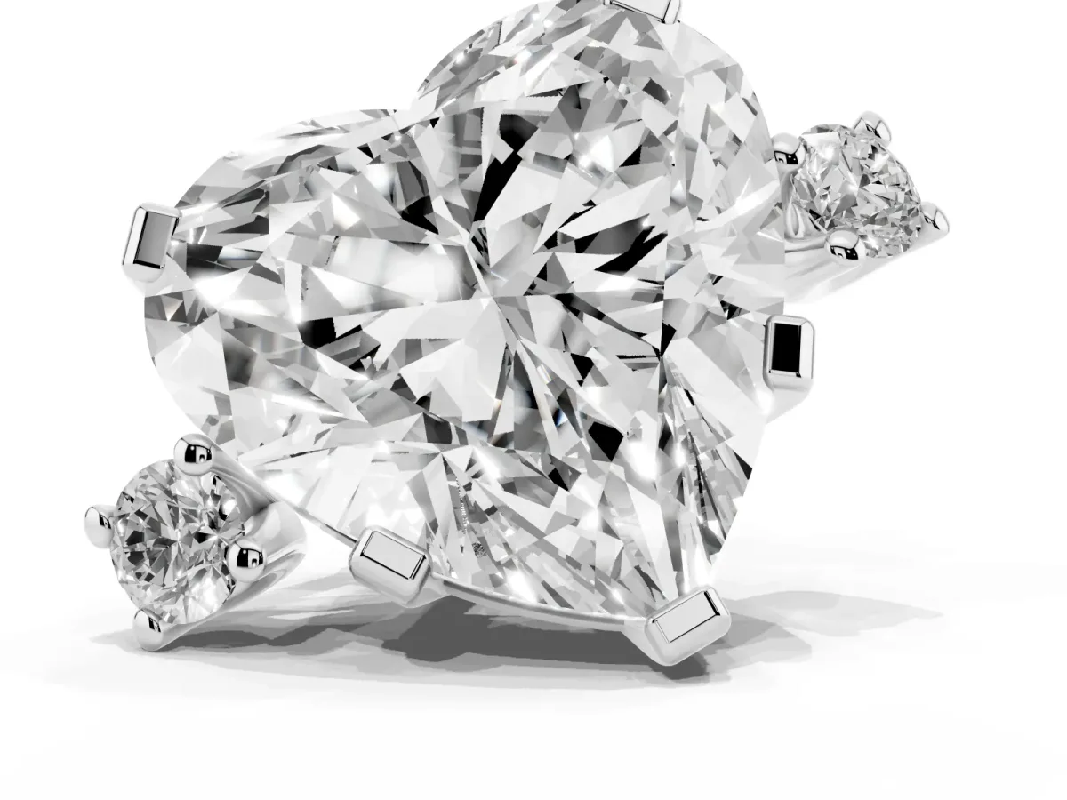 Heart Cut Cut Three-Stone Solitaire Ring with Round Accent Diamonds and Four-Prong Setting Silver