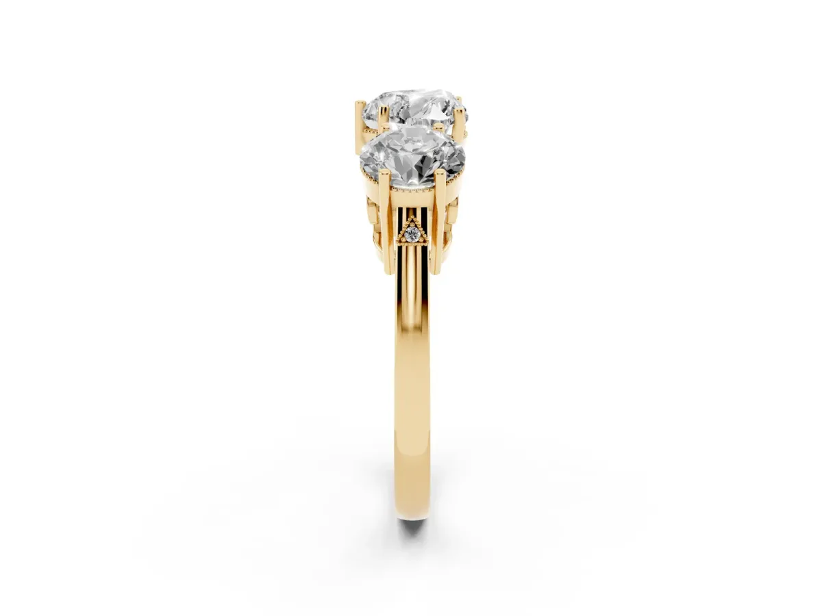 Three-Stone Heart Cut Diamond Engagement Ring with Prong Setting on a Classic Band Yellow gold