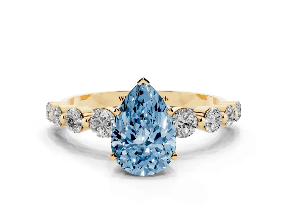 Fancy Blue Pear Cut Solitaire Diamond Ring with Pave Band and Four-Prong Setting Yellow gold
