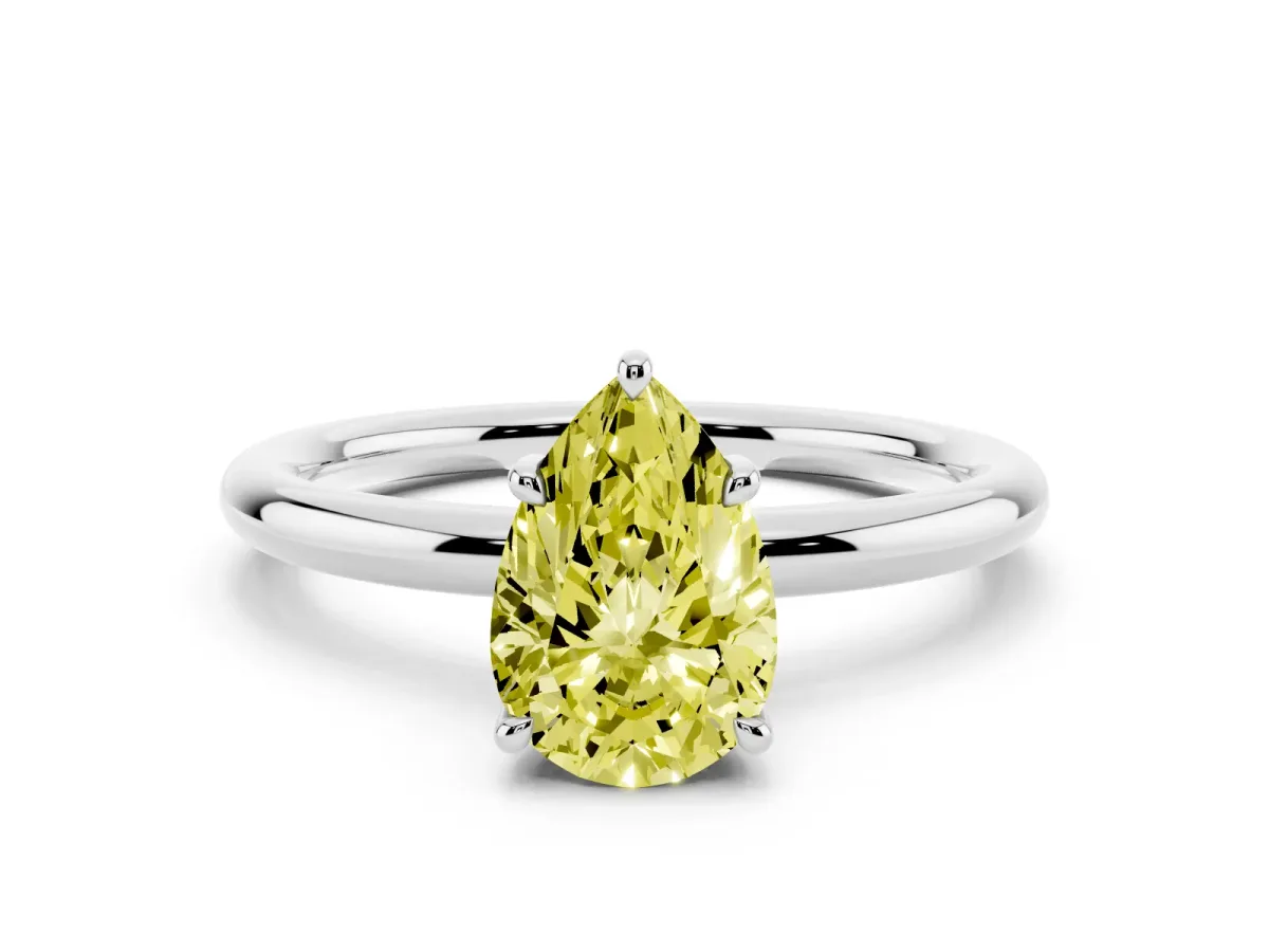 Fancy Yellow Pear Cut Diamond Solitaire Ring with Thin Band and Four-Prong Setting Silver