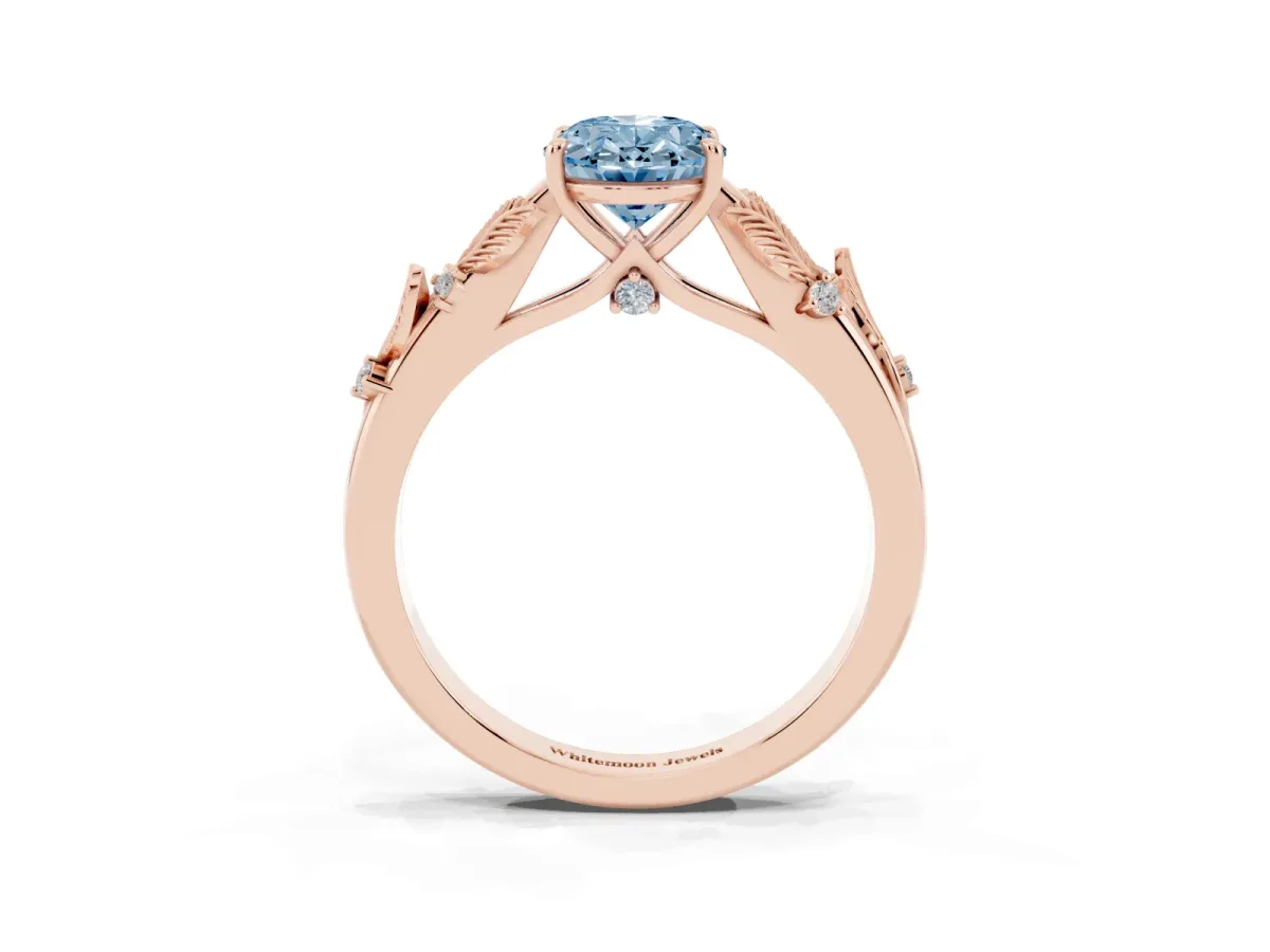Fancy Blue Oval Cut Diamond Solitaire Ring with Leaf Motif Band and Four-Prong Setting Rose gold
