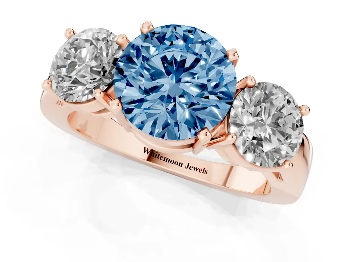 Fancy Blue Three-Stone Round Cut Diamond Ring with Round Side Stones, Classic Band, and Four-Prong Setting Rose gold