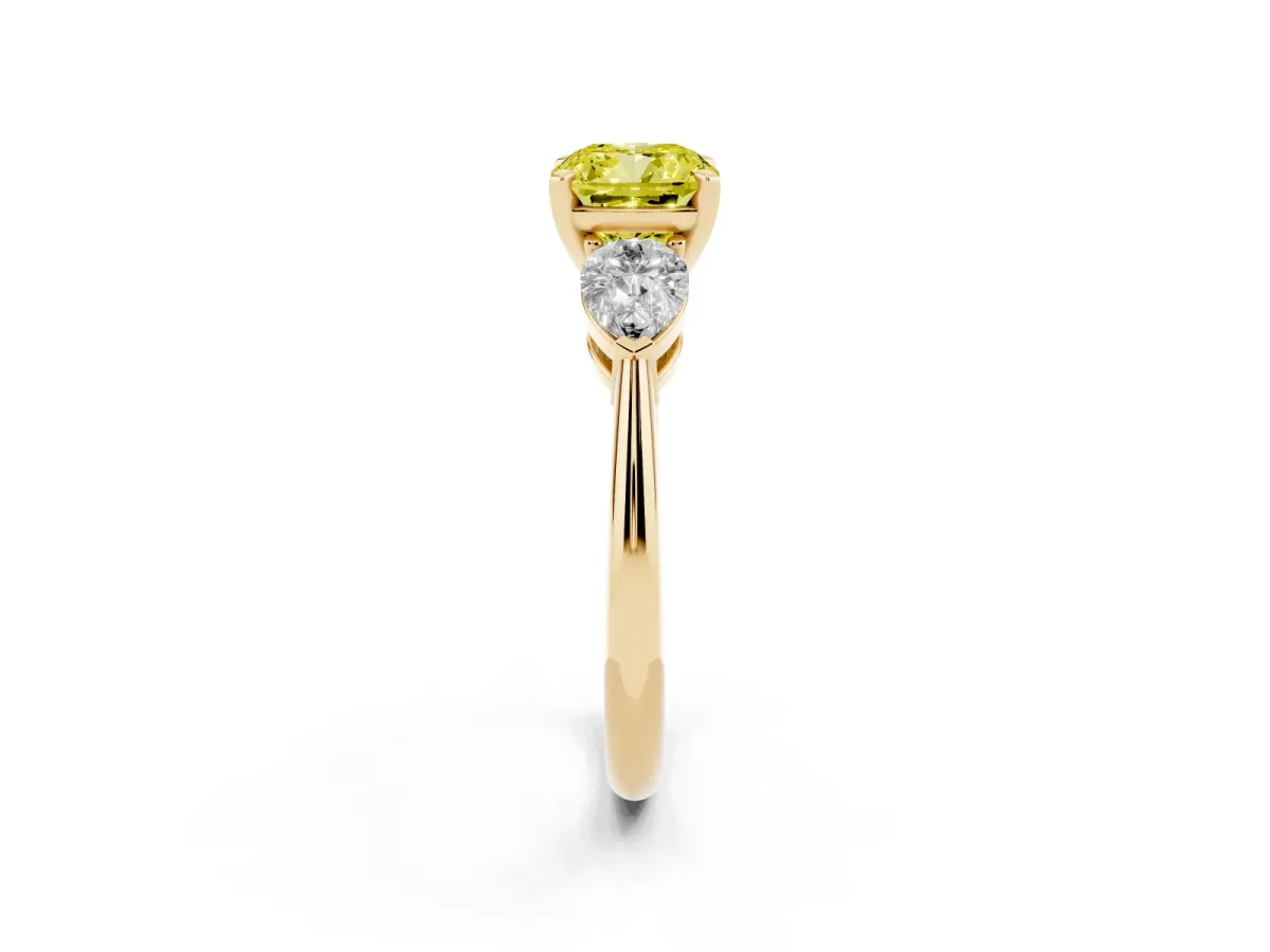 Fancy Yellow Three-Stone Cushion Cut Diamond Ring with Pear Side Stones and Four-Prong Setting Yellow gold