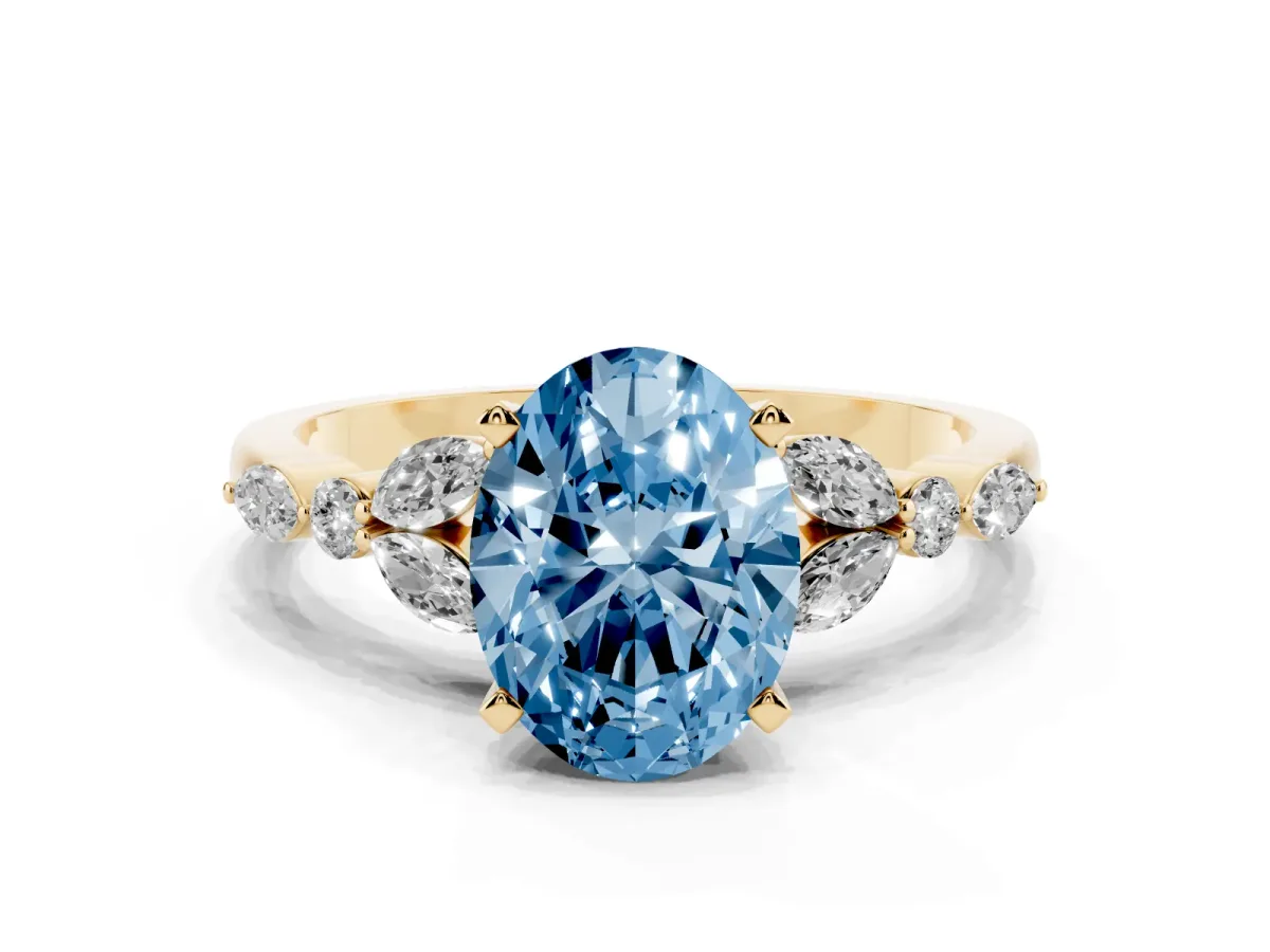 Fancy Blue Oval Cut Diamond Solitaire Ring with Side Stones and Four-Prong Setting Yellow gold