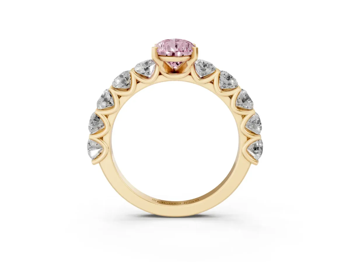 Fancy Pink Pear Cut Diamond Prong Setting with Side Stones on a Pave Band Yellow gold