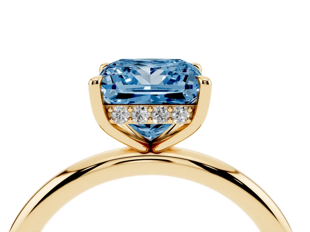 Fancy Blue Princess Cut Diamond Solitaire Ring with Thin Band and Four-Prong Setting Yellow gold