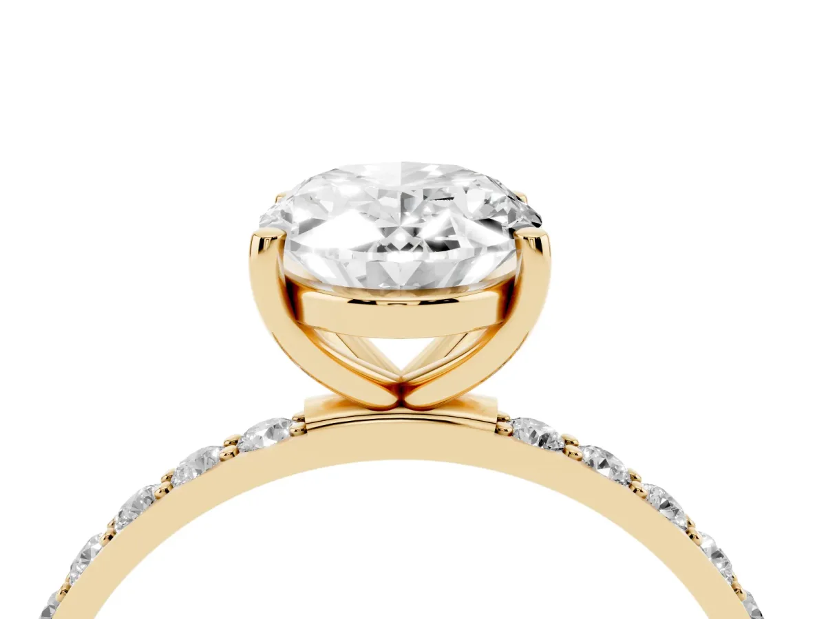 Oval Cut Diamond Solitaire Ring with Round Pavé Shoulders and Prong Setting Yellow gold