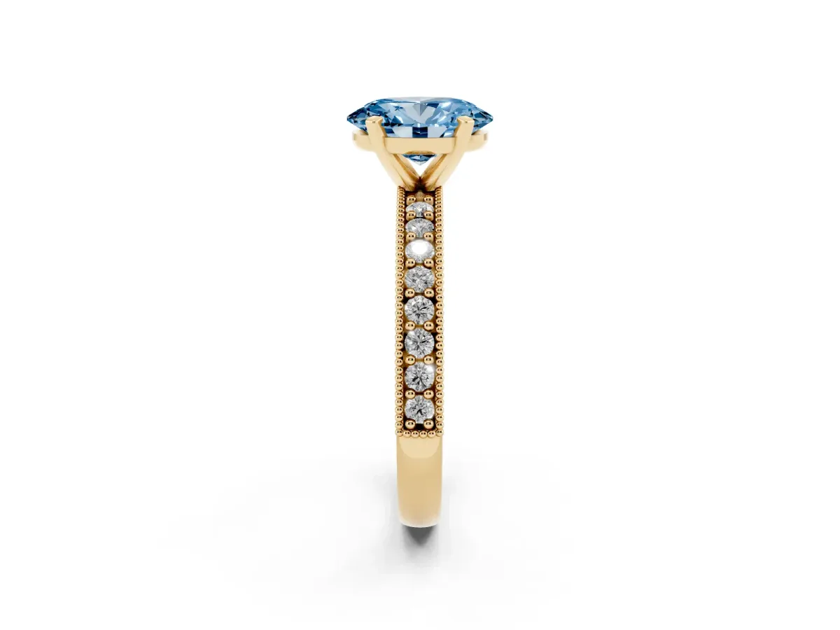 Fancy Blue Oval Cut Diamond Milgrain Pavé Engagement Ring with Four-Prong Setting Yellow gold