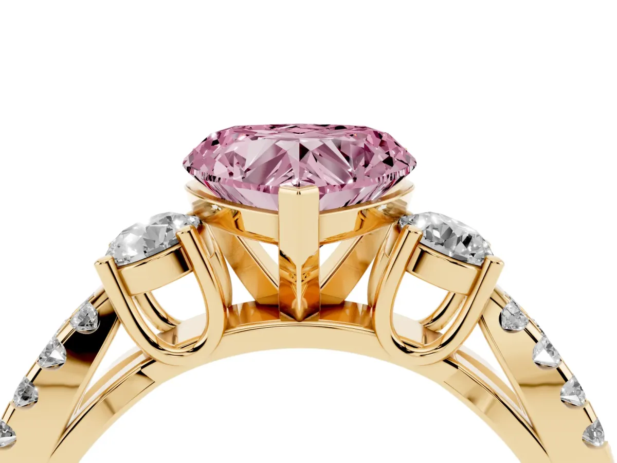 Fancy Pink Heart Cut Diamond Three-Stone Ring with Pavé Split Shank and Four-Prong Setting Yellow gold