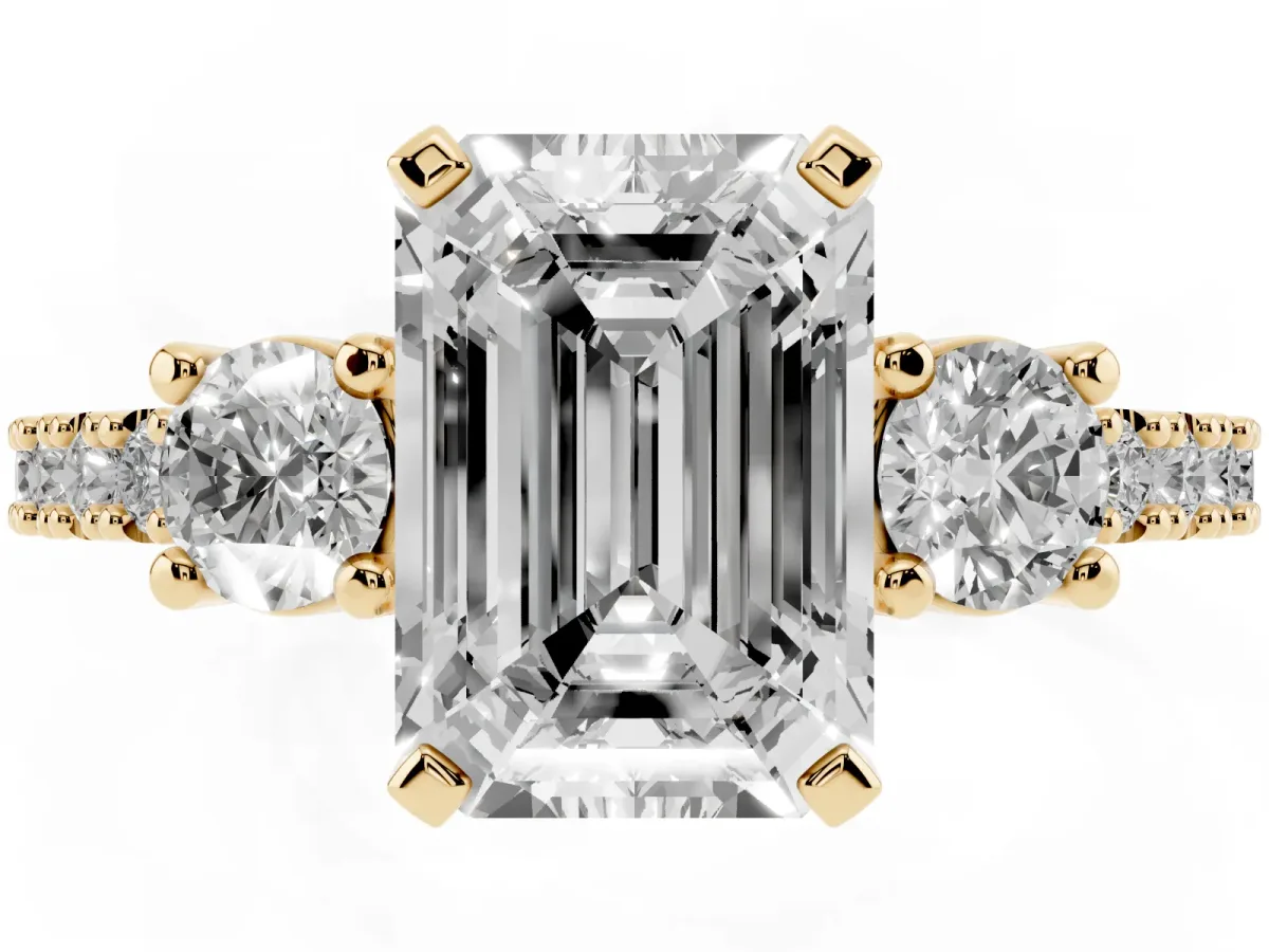 Emerald Cut Three-Stone Diamond Pavé Band with Prong Setting Yellow gold