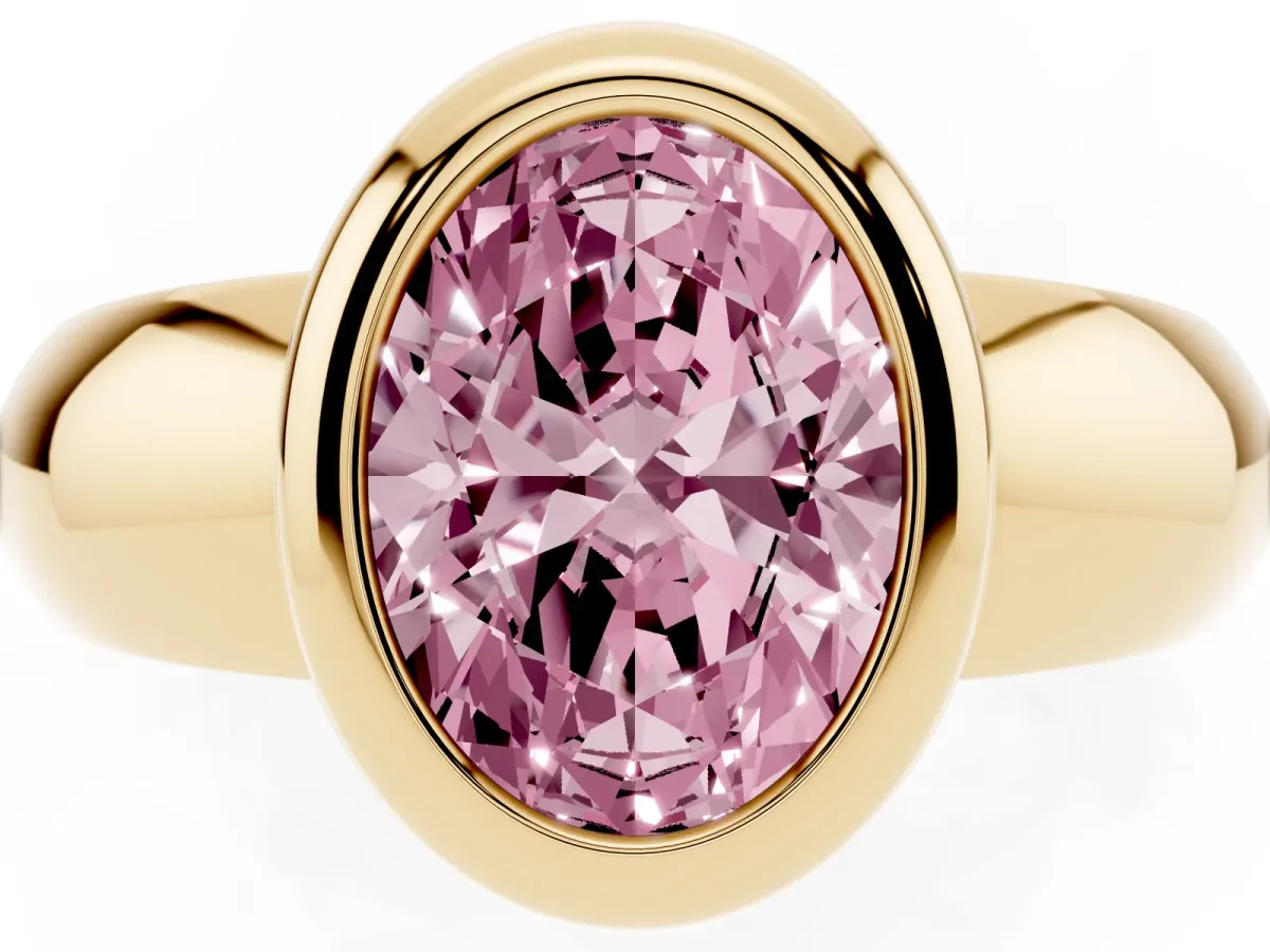 Fancy Pink Bezel Set Oval Cut Solitaire Ring with Wide Band Yellow gold
