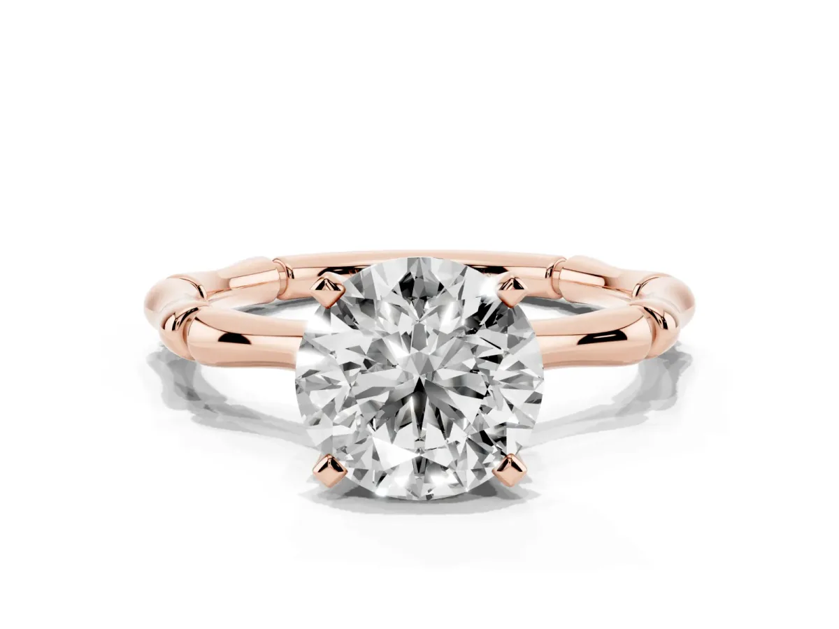 Round Cut Solitaire Diamond Ring with Bamboo Band and Four-Prong Setting Rose gold