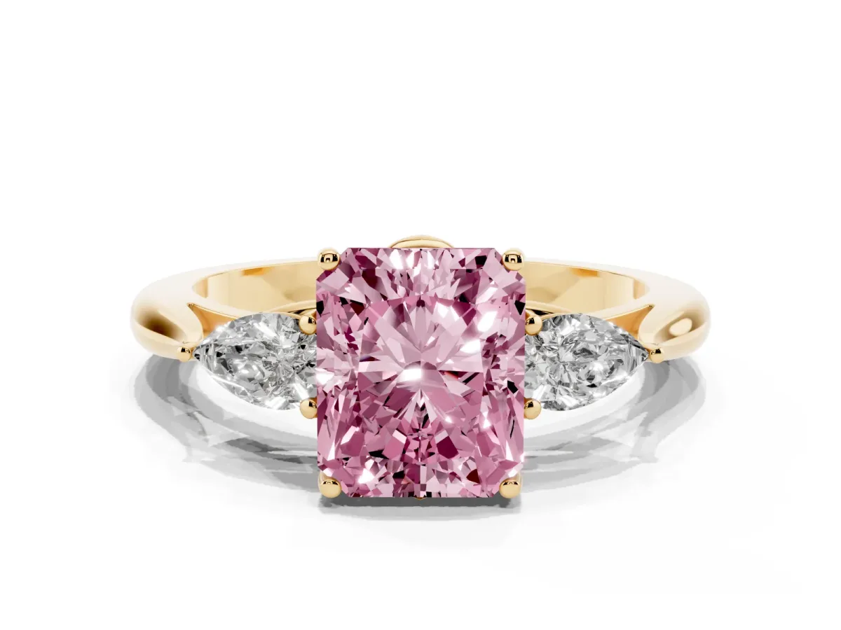 Fancy Pink Radiant Cut Diamond Three-Stone Ring with Pear Side Stones and Prong Setting Yellow gold