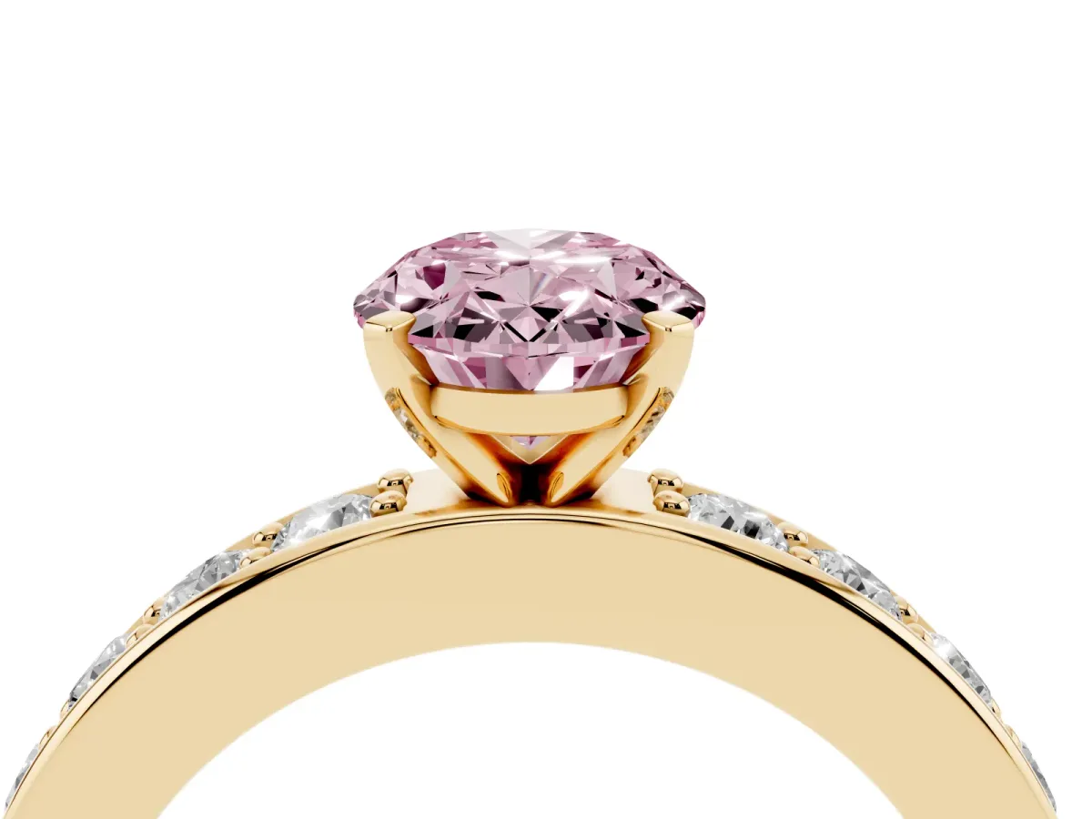 Fancy Pink Oval Cut Diamond Engagement Ring with Channel Set Round Band and Prong Setting Yellow gold