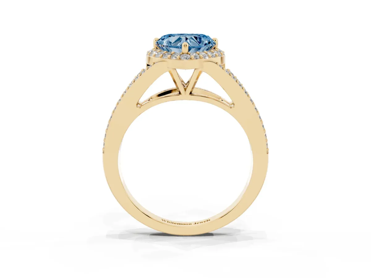 Fancy Blue Heart Cut Halo Split Shank Pave Diamond Ring with Four-Prong Setting Yellow gold