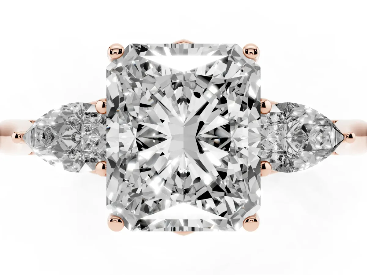 Three-Stone Radiant Cut Diamond Ring with Pear Side Stones in Four-Prong Setting Rose gold