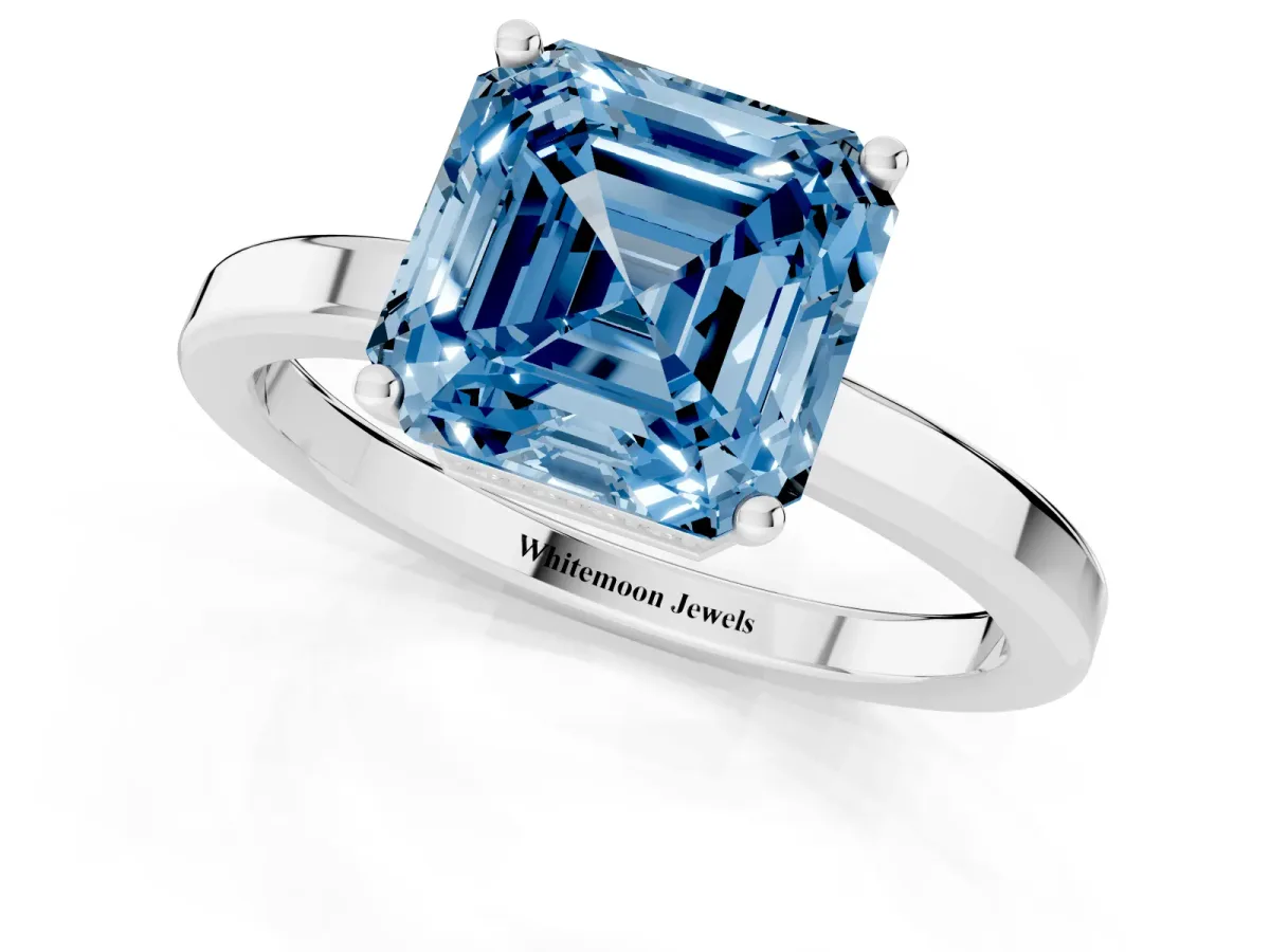 Fancy Blue Asscher Cut Cut Solitaire Engagement Ring with Four-Prong Setting on a Classic Band Silver