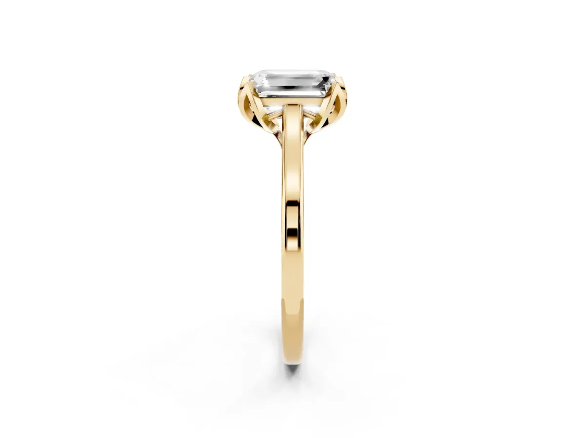 Emerald Cut Diamond Solitaire Ring with Flower Prong Setting and Classic Band Yellow gold