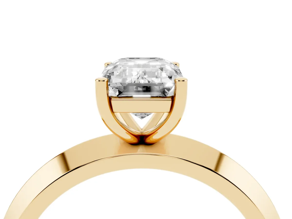 Emerald Cut Cut Solitaire Engagement Ring with Flat Band and Four-Prong Setting Yellow gold