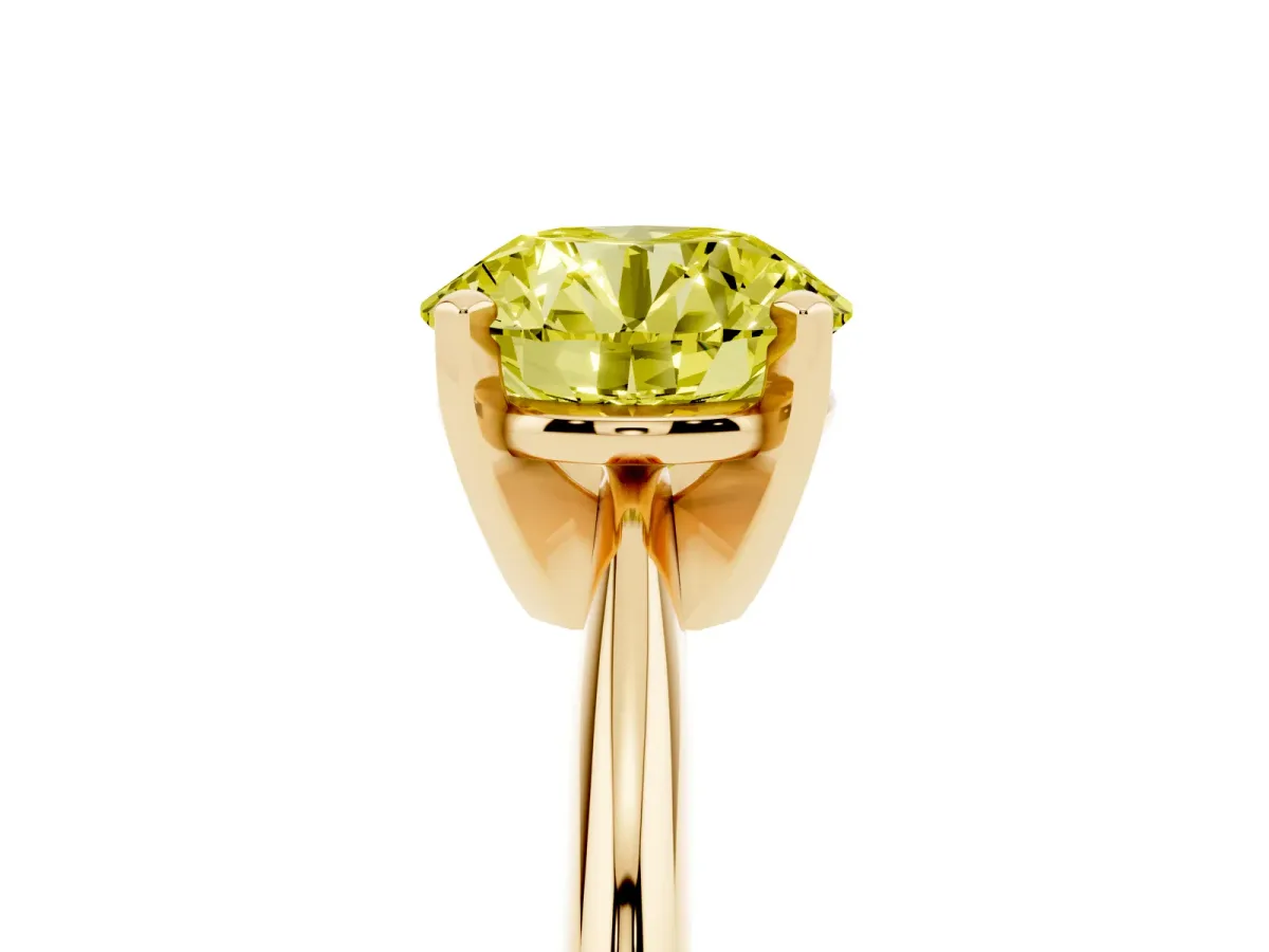 Fancy Yellow Round Cut Cut Solitaire Ring with Four-Prong Setting on a Classic Band Yellow gold