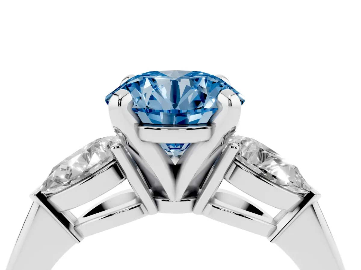 Fancy Blue Three-Stone Round Cut Diamond Ring with Pear Side Stones and Four-Prong Setting Platinum