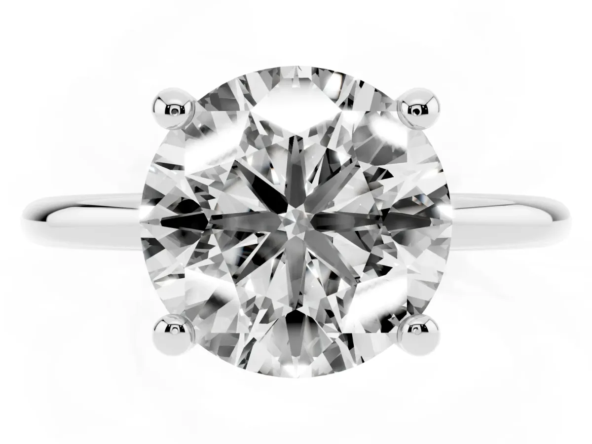 Round Cut Solitaire Diamond Ring with 4-Prong Setting on a Classic Band Platinum