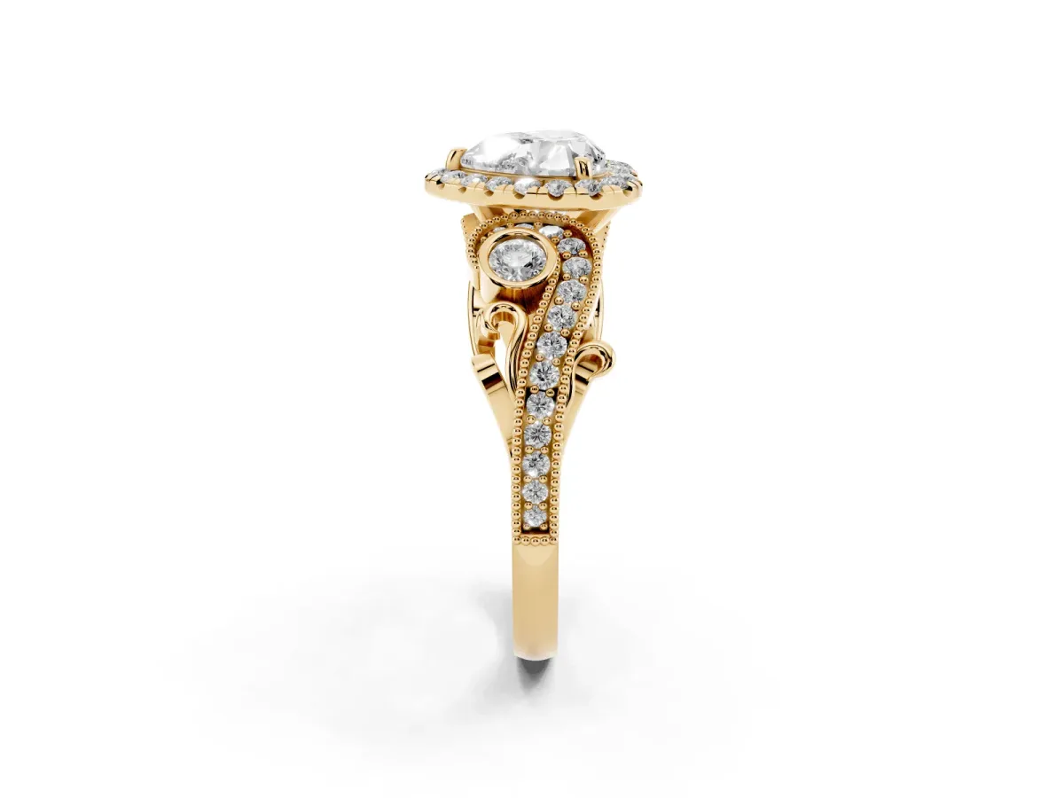 Heart Cut Halo Diamond Ring with Milgrain and Bezel Accents on a Split Shank Band Yellow gold