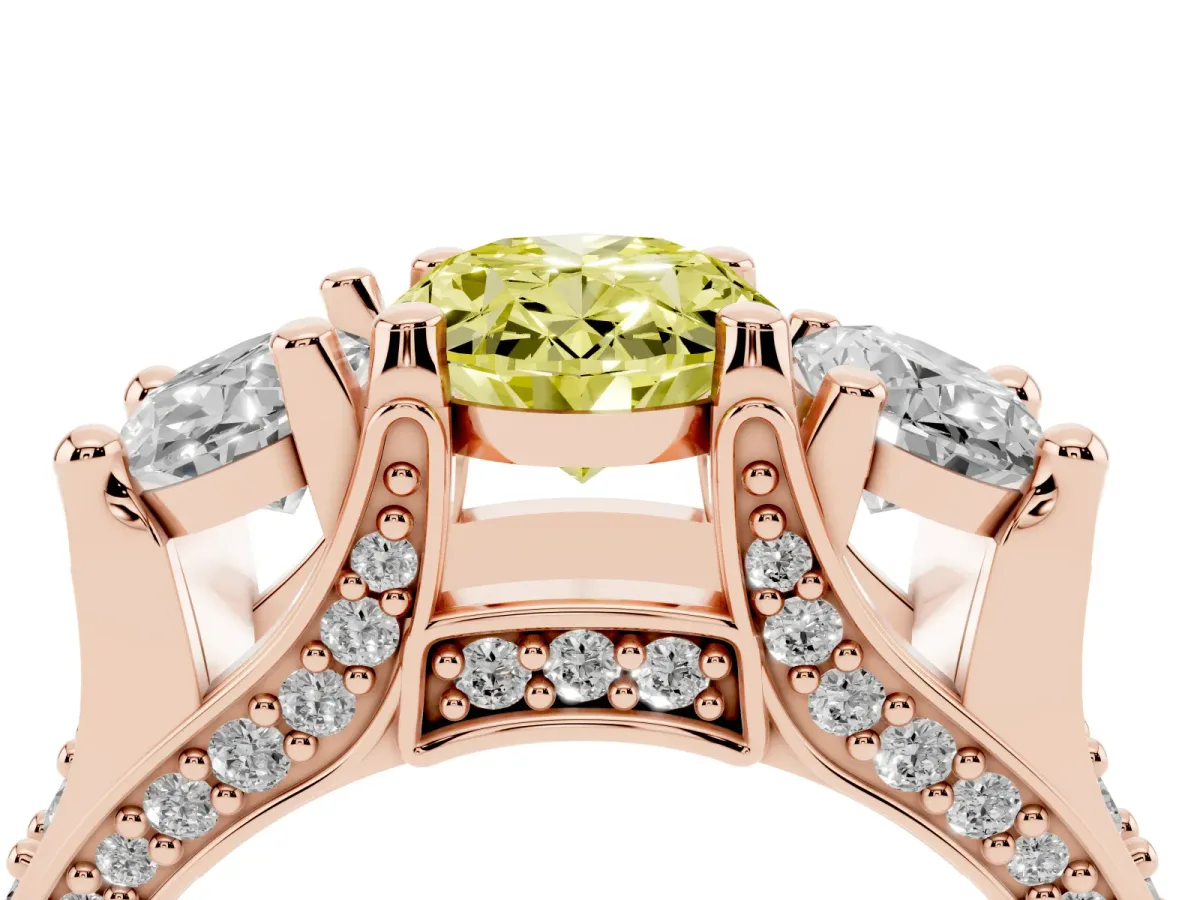 Fancy Yellow Oval Cut Diamond Three-Stone Ring with Channel Set Band and Four-Prong Setting Rose gold