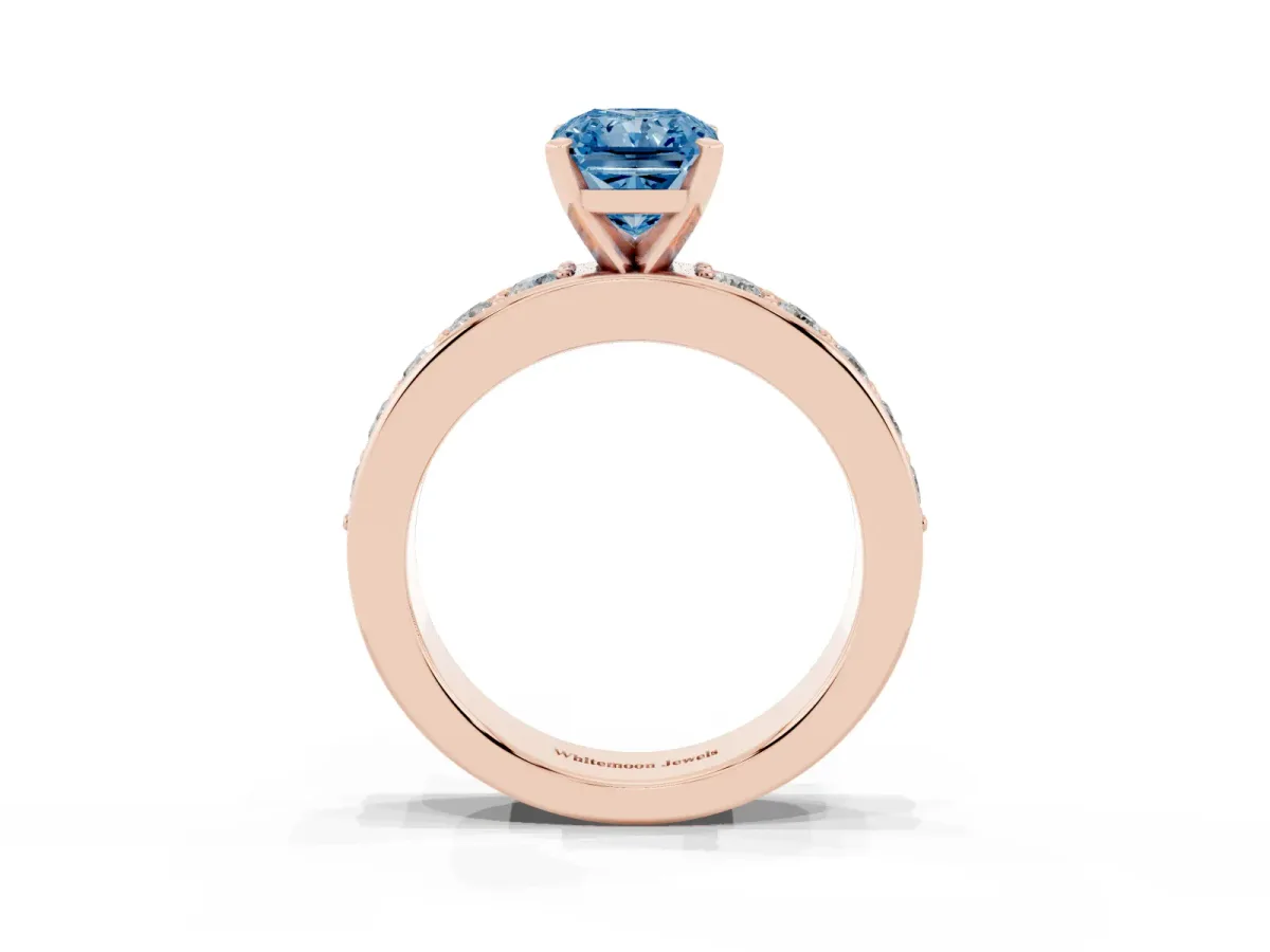 Fancy Blue Radiant Cut Diamond Engagement Ring with Channel Set Round Band and Prong Setting Rose gold